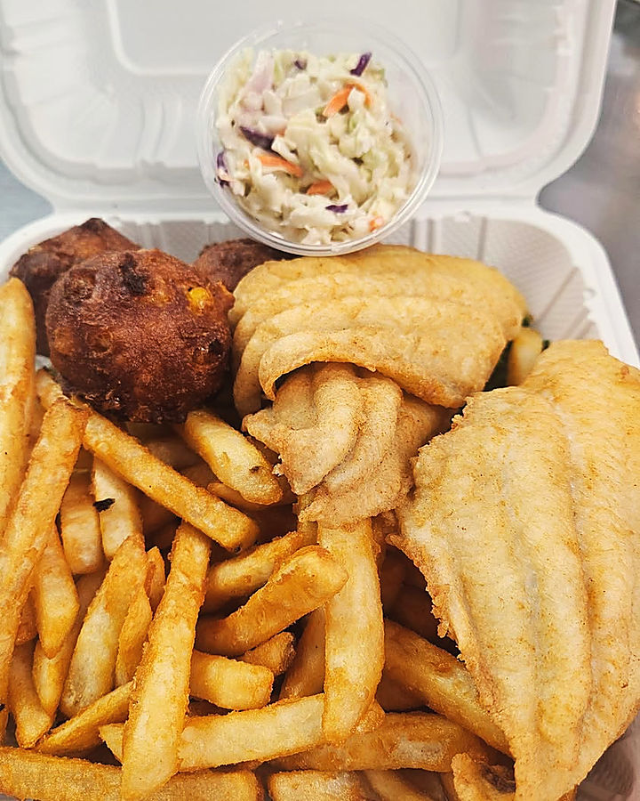 Fried fish, fries, corn nuggets and slaw